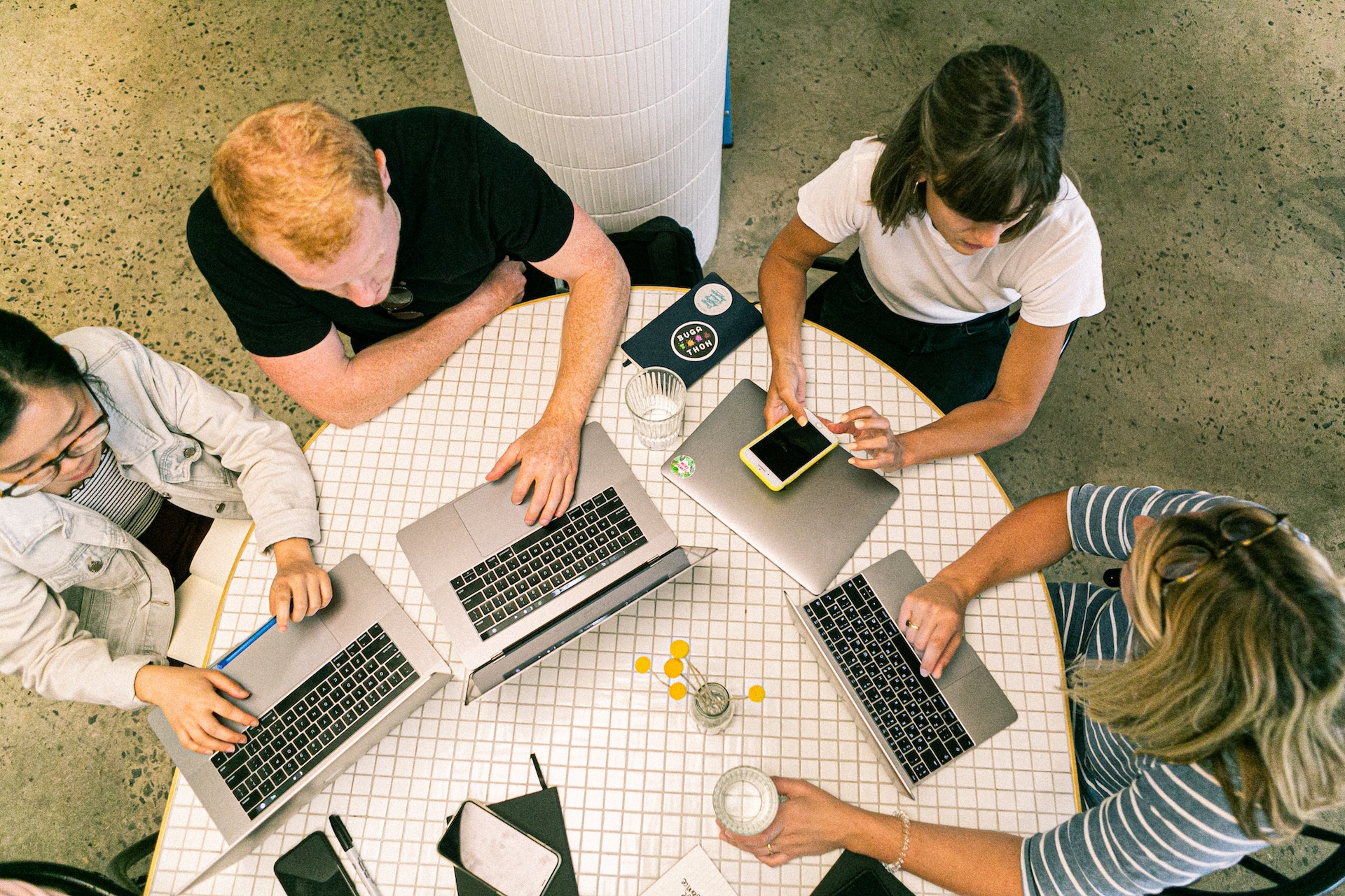 Photo by Canva Studio: https://www.pexels.com/photo/four-people-using-laptop-computers-and-smartphone-3277808/