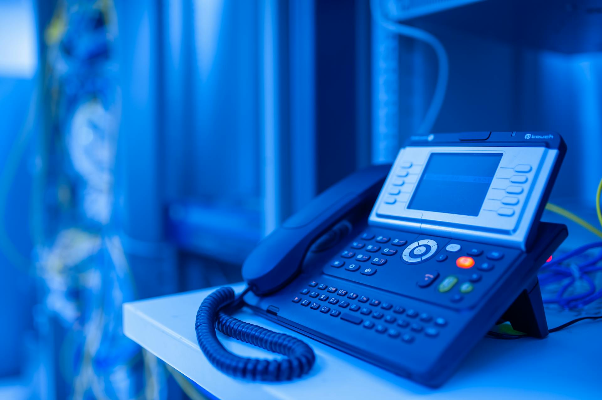 Photo by panumas nikhomkhai: https://www.pexels.com/photo/ip-phone-in-data-center-room-17636234/